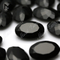 material de piedras preciosas naturales ónix negro facetado ovalado de China
